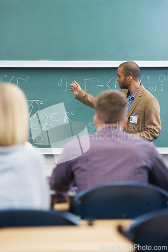 Image of Board, lecture and professor with students in classroom for mathematics lesson at university campus. Education, learning and college teacher explaining work or teaching for assignment, test or exam.