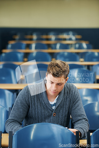 Image of Writing, college and man student in classroom brainstorming for exam studying ideas. Planning, education and young male person in lecture hall with question for university assignment at academy.