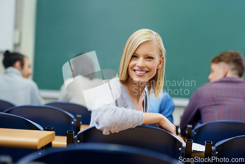Image of University student, portrait and education at classroom desk in London for english lecture, knowledge or scholarship. Female person, face and academy for certificate or diploma, teaching or lesson
