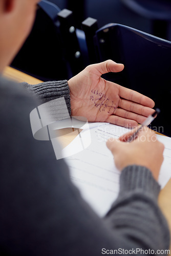 Image of Hand, test and cheating with answer for math exam in classroom for equations, geometry or education. Student, palm and formula note or paperwork for study assessment or university, secret or lying