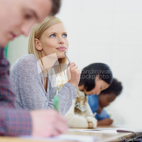 Image of Student, desk and thinking in university for test in english literature or scholarship, learning or knowledge. Female person, thoughts and education for school development or future, course or London