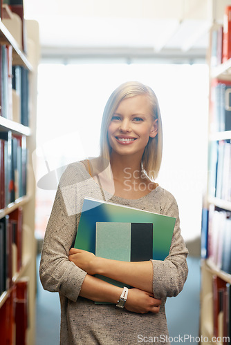 Image of Woman, library and books, portrait for education and knowledge with smile on campus. College student, bookstore and reading material for learning, happy with university and academic development