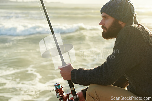 Image of Man, thinking and fishing by ocean in relax, nature and fish recreation for wellness on vacation. Fisherman, waiting and holiday in cape town by beach, adventure and summer by rod for travel to bite