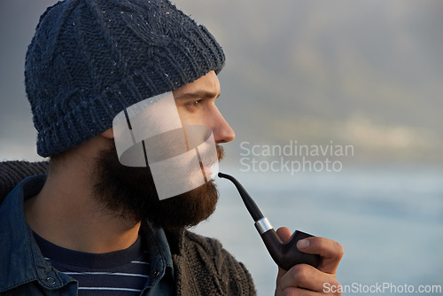 Image of View, man and smoking a pipe in nature, thinking and tobacco habit on winter morning for creative idea. English guy, nicotine and vintage smoker for planning, satisfaction and vacation in cape town