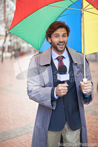 Image of Weather, man and reporting on rain, umbrella and journalism with media and anchor. Presenter, meteorology and person with microphone and professional in New York city with info and breaking news