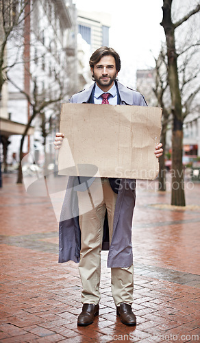 Image of Recession, business and man with cardboard, unemployed in city and professional with stress or poverty. Person, outdoor or financial criss with worker or stock market crash with job loss with mockup