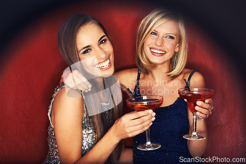 Image of Happy, cocktails and portrait of women at event for party, bonding or happy hour together. Smile, confidence and young female friends with alcohol drinks at night club for celebration and fun.