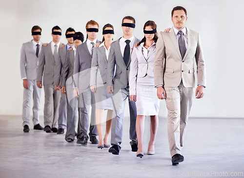 Image of Business people, blindfold and leader for team confidence, united and lost in workplace. Management, employees and collaboration in uncertainty, control strategy and support in direction or workforce