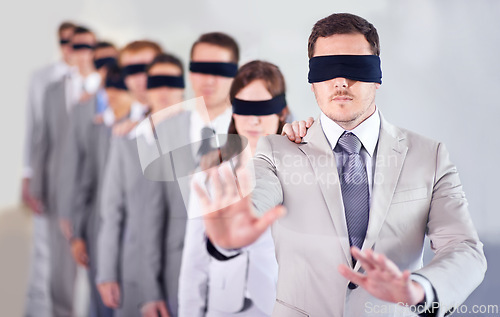 Image of Business people, blindfold and leader in office, team and solidarity in workplace. Challenge, employees and collaboration in uncertainty, control strategy and support in searching or workforce