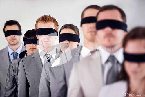 Image of Business people, blindfold and employees lost at work, together and coworkers trust in workplace. Blind, team and collaboration in uncertainty, control strategy and support in challenge or workforce