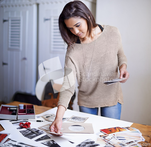 Image of Woman, photographer and portfolio picture or creative decision for concept board, planning or inspiration. Female person, images and print outs on desk for art career for project, proposal or studio