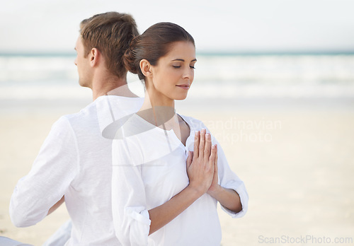 Image of Couple, yoga and sea with meditation, summer and waves on sand in morning with mindfulness outdoor. Man, woman and peace for namaste with spiritual growth, balance and zen at beach in Cape Town