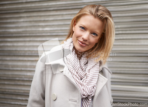 Image of Woman, smile and portrait in city, winter and trendy style with scarf, fashion and commute on metro road. Girl, person and happy with edgy clothes for journey on urban sidewalk by street in Cape Town