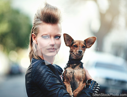 Image of Woman, portrait and punk fashion with pet, edgy and rock n roll for cool in funky clothes and care for chihuahua dog. London, person and face in leather jacket in town and love for domestic animal