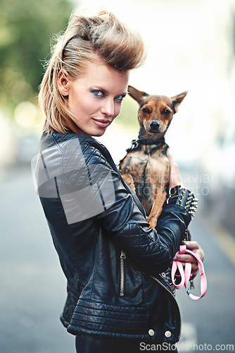 Image of Woman, portrait and leather jacket with pet, smile and rock n roll for unique in punk fashion and love for pet chihuahua. London, person and face in funky clothes in town and care for domestic animal