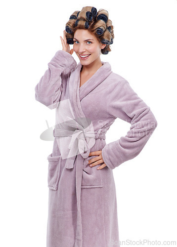 Image of Portrait, hair and woman with curlers in studio, morning routine and preparation for hairstyle. Female person, cosmetic treatment and rollers for grooming, white background and robe for beauty