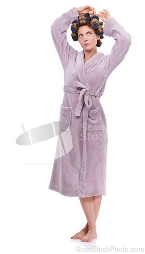 Image of Hair, rollers and bathrobe with confused woman in studio isolated on white background for pampering. Wellness, beauty and morning with young person in bathroom to relax for haircare treatment