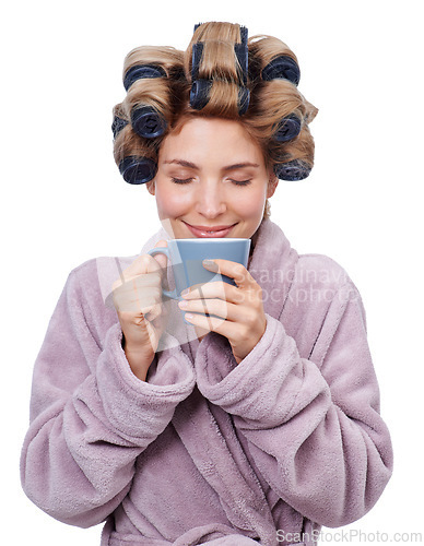 Image of Face, coffee and curlers in hair of woman in studio isolated on white background for salon treatment. Smile, beauty and aroma with happy young person in bathrobe for morning routine and haircare