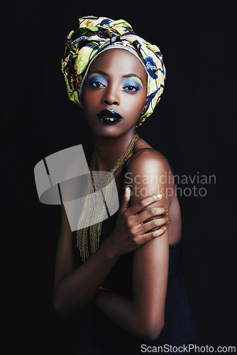 Image of Black woman, beauty and portrait with fashion, skincare and makeup in studio. Cosmetics, trendy and afro style with African female person from Kenya with traditional hair wrap with black background