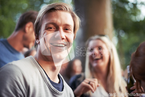 Image of Portrait, smile and man camping with friends outdoor in forest or woods for travel, festival or vacation. Face, nature or summer with happy young person and group of people together for adventure