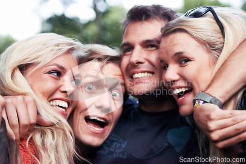 Image of Face, smile and hug with excited friends closeup outdoor in nature together for travel, festival or adventure. Party, energy or wow with man and woman group laughing in forest or woods in summer