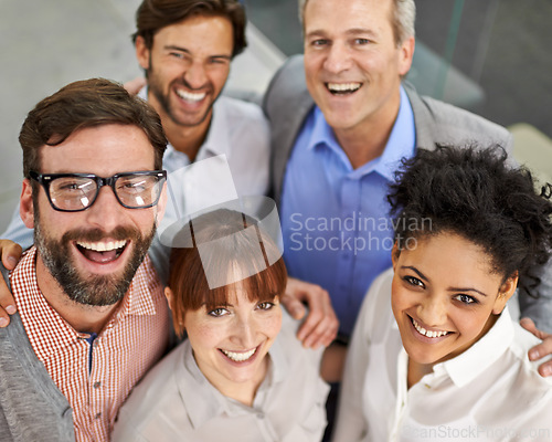 Image of Businesspeople, portrait and smile in office with confidence from above for collaboration, teamwork or partnership. Men, women and happy at creative agency for startup pride, workspace or together