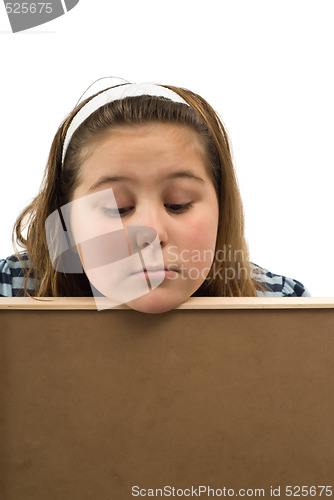 Image of Girl Looking Over Wall