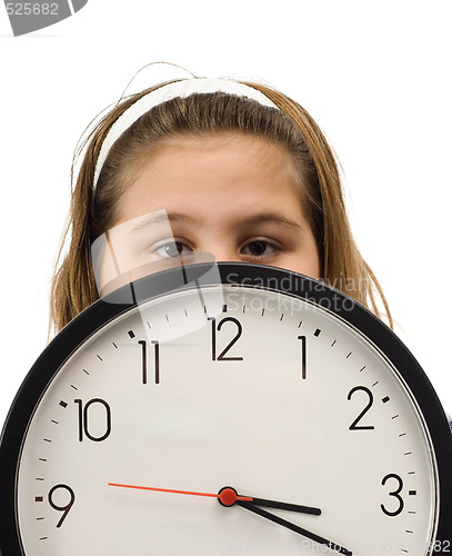 Image of Girl Hiding Behind Clock