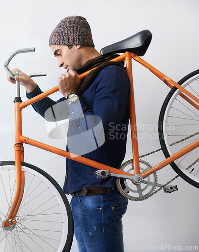 Image of Man, studio and bicycle for sustainability, health and transportation on white background. Hipster cyclist, carbon neutral or eco friendly travel for environmental commute and fitness or exercise