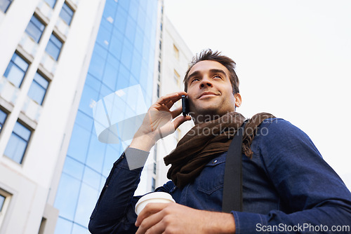 Image of City, buildings and man with phone call for communication, conversation or networking in Los Angeles. Male person, technology and smile with smartphone, contact and happy in morning from low angle