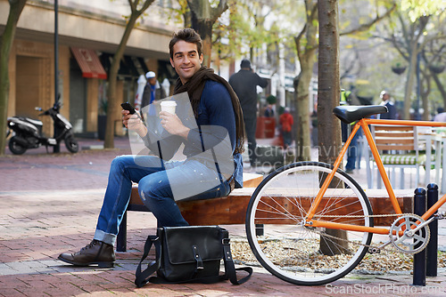 Image of Man, smartphone and coffee and bike for travel and carbon footprint, communication and cycling outdoor. Eco friendly transport, using phone for location in city for journey with bicycle and drink