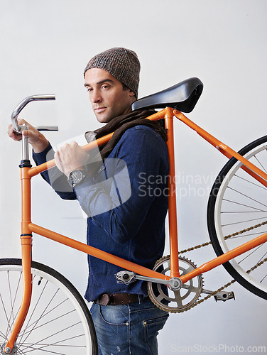 Image of Man, studio and bicycle for sustainability, exercise and transportation on white background. Hipster cyclist, carbon neutral and eco friendly travel for environmental commute or fitness and trip