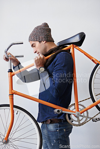 Image of Man, studio and bike for sustainability, transportation or exercise on white background. Hipster cyclist, carbon neutral and eco friendly travel for environmental commute or fitness and trip