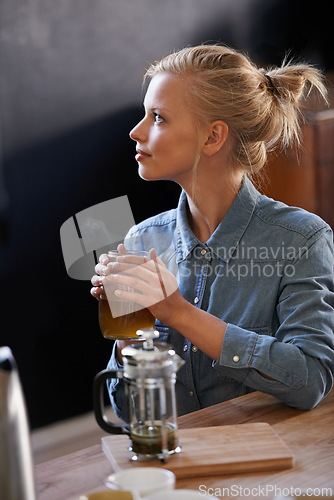 Image of Woman, thinking and home with tea jug in kitchen for vision, idea and plunger for healthy and warm beverage. House, morning and fresh to taste, drink and relax for detox, enjoy and productive day.