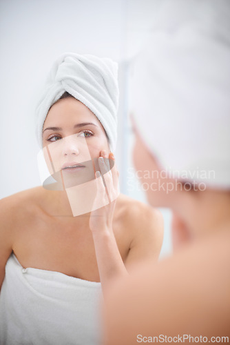 Image of Women, selfcare and mirror for skincare, spa day routine and bathroom getting ready for organic wellness. Female person, towel and hand on face, reflection and treatment for shower and cleanliness