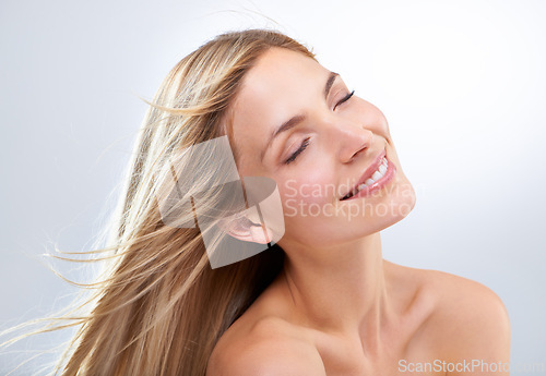 Image of Beauty, hair and face of woman in studio with natural makeup, smile and straight balayage hairstyle. Haircare, cosmetics and happy model with keratin growth, relax and girl on white background.