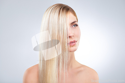 Image of Straight hair, beauty and blonde woman in makeup, care or thinking isolated on a white studio background. Face, hairstyle and serious model in cosmetics, hairdresser and salon treatment for keratin