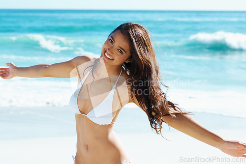 Image of Water, portrait and happy woman on beach with freedom, bikini and excited for summer holiday in Cancun. Smile, sun and girl on ocean vacation with adventure, travel and relax on tropical island.