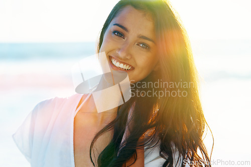 Image of Indian woman, beach and smile for ocean, waves and breeze for summertime in Bali for vacation. Female, sea and holiday relaxation abroad in swimsuit, sand and happy for portrait, memories and trip.