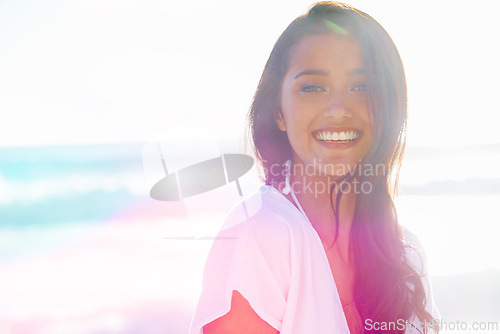 Image of Indian woman, beach and smile for ocean, waves and breeze for summertime in Bali for vacation. Female, sea and holiday relaxation abroad in swimsuit, sand and lens flair portrait and memories