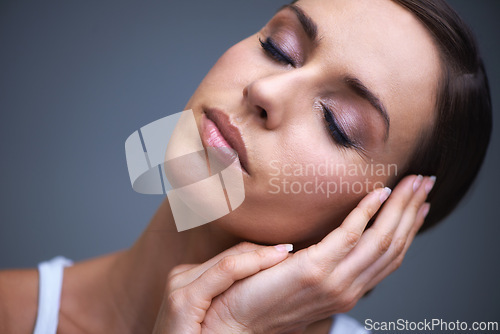 Image of Calm woman, skincare and beauty makeup in cosmetics or facial treatment on gray studio background. Face of female person or model in relax or satisfaction for eye shadow or foundation on mockup space