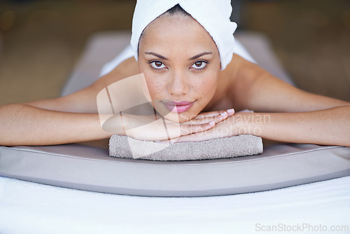 Image of Spa, woman and portrait on massage bed with relax for wellness, zen and beauty treatment for body care. Person, face and stress relief at resort, salon table and peaceful on holiday or vacation