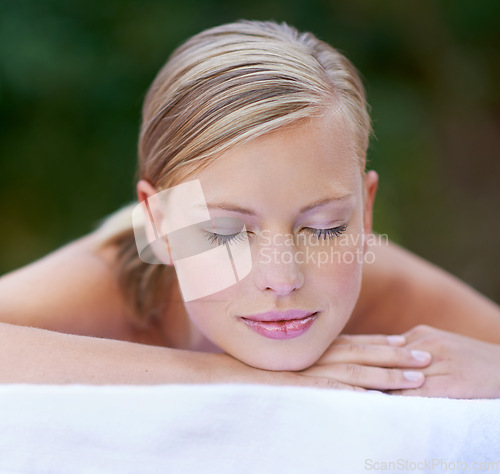 Image of Woman, spa and sleeping after massage, facial or hotel beauty treatment with rest. Relax, calm and nap from cosmetics, care and hospitality from skincare and wellness zen with peace at a resort