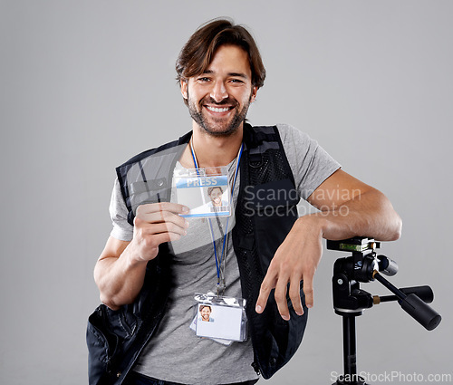 Image of Man, portrait with press or media, cameraman in studio for interview or news, photographer and ID card on grey background. Photo journalist, reporter or paparazzi, identification and professional