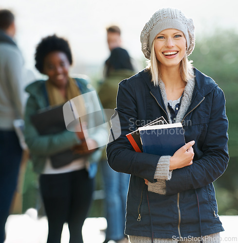 Image of Student, woman and smile with books on campus, education and learning material for studying. Happy, scholarship and university for academic growth, textbook or notebook with knowledge in portrait