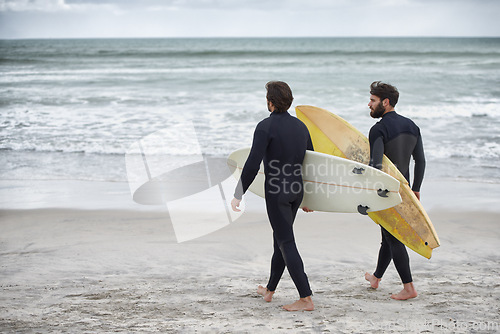 Image of Man, friends and surfer at beach for waves, sport or exercise on sandy shore in outdoor fitness. Rear view of male person or people with surfboard for surfing on ocean coast, sea or water in nature