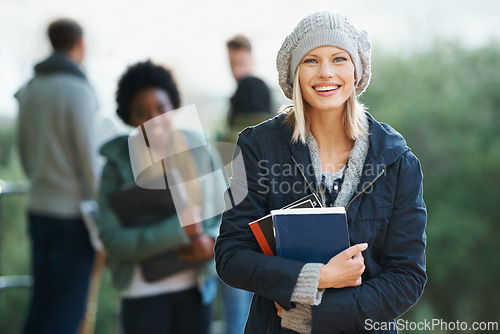Image of Student, woman and happy in portrait with books on campus, education and learning material for studying. Smile scholarship and university for academic growth, textbook or notebook with knowledge