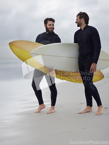 Image of Happy man, friends and surfer at beach for exercise, sport or waves on sandy shore in outdoor fitness. Male person or people with surfboard for surfing or hobby on ocean coast, sea or water in nature