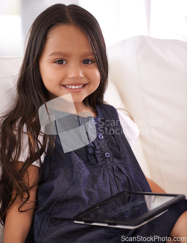 Image of Portrait, happy girl and child with tablet on sofa for entertainment, internet or social media at home. Face of female person or little kid with smile, technology or ebook in living room at house