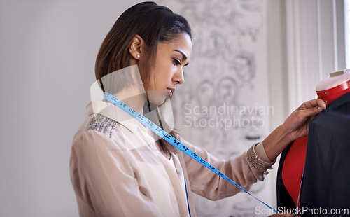 Image of Fashion, tailor and measure clothes on mannequin for sewing in workshop with creative project. Seamstress, measuring tape and working with textile fabric for garment fitting with material on dummy